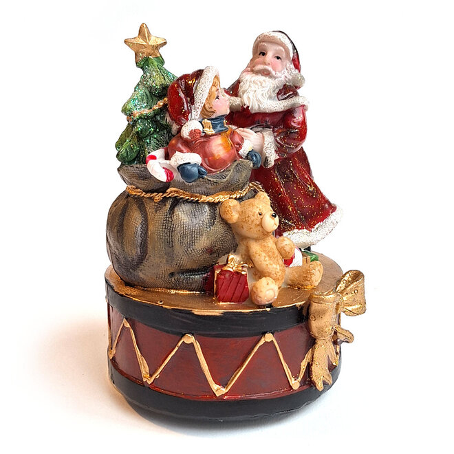 Kerstman met kind bij kadozak