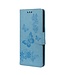 Blauw Vlinder en Bloemen Bookcase Hoesje voor de LG Velvet