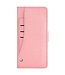 Roze Jeans Bookcase Hoesje met polsbandje voor de iPhone 14