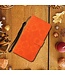 Oranje Bloemetjes Bookcase Hoesje voor de Samsung Galaxy S23
