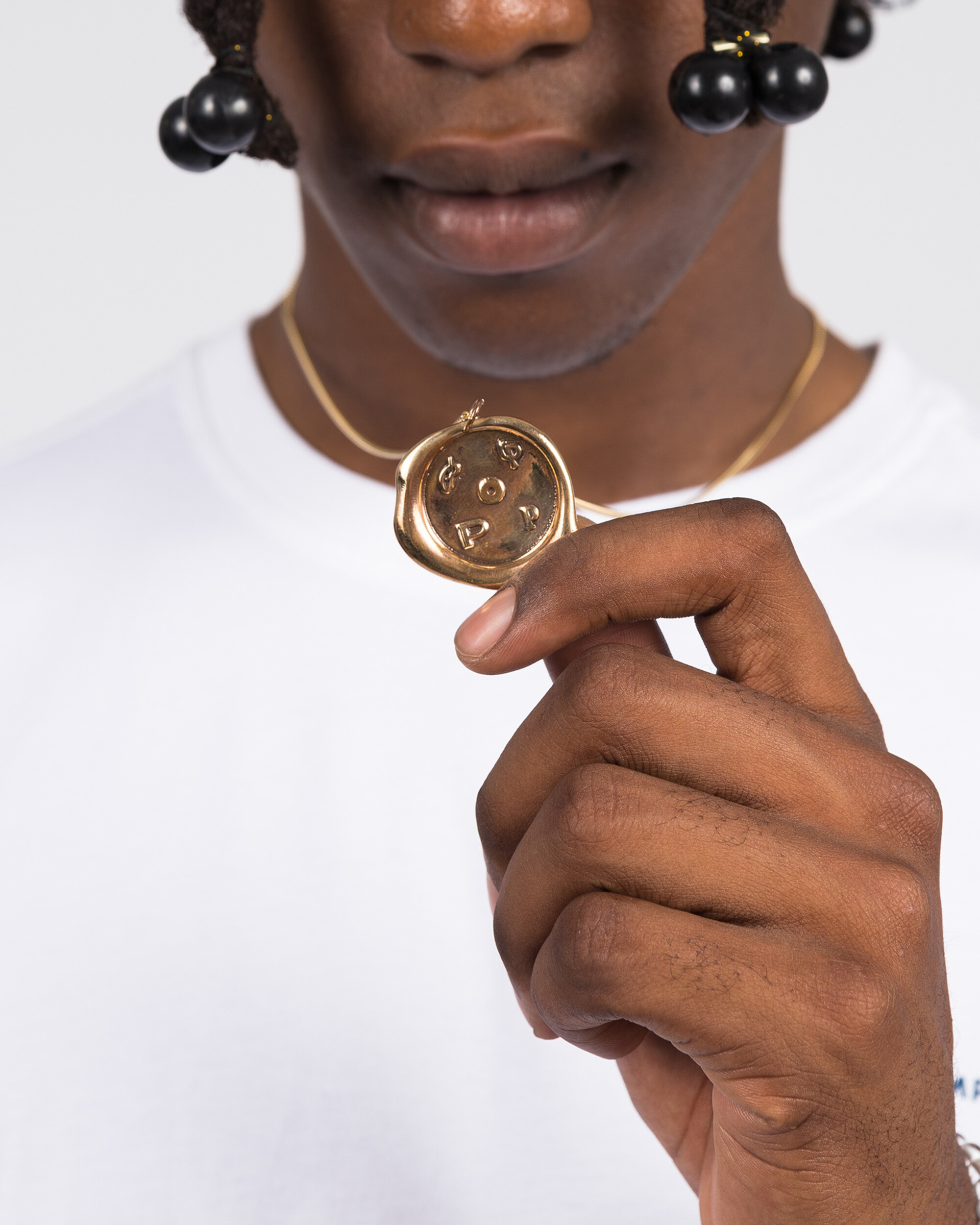 Pop Trading Co X parra bronze pendant