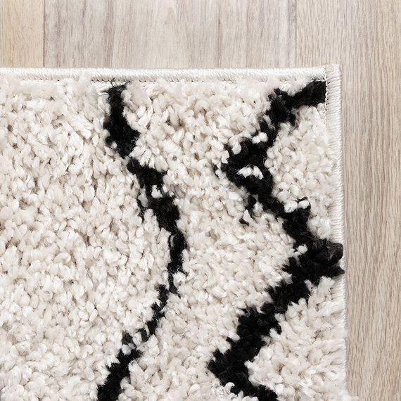 FRAAI Hoogpolig vloerkleed - Grand Outline Creme/Zwart