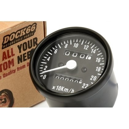 Zwarte mini snelheidsmeter met zwarte wijzerplaat.