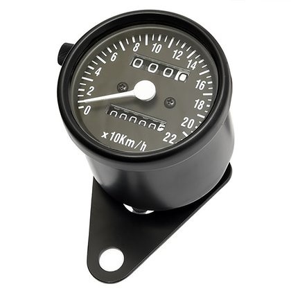 Zwarte mini snelheidsmeter met zwarte wijzerplaat.