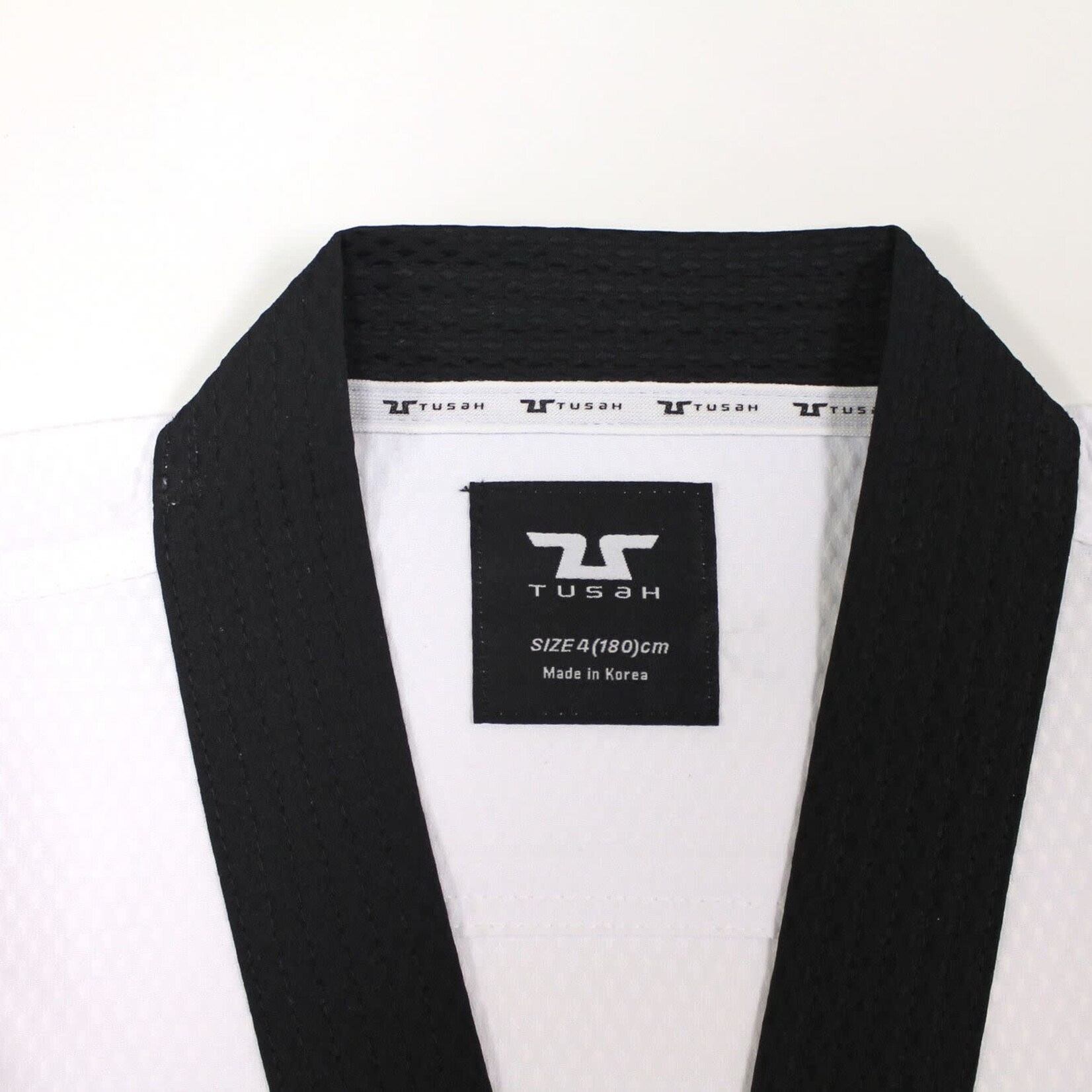Tusah Tusah  WT Approved Dobok Black Collar