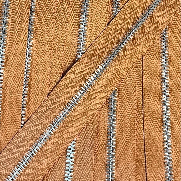 Metalen rits nikkel maat 3 oranjebruin