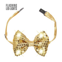 pailletten strikje met licht, goud