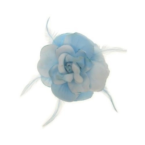 Mooie lichtblauwe bloem met glitters op een elastiek en speld