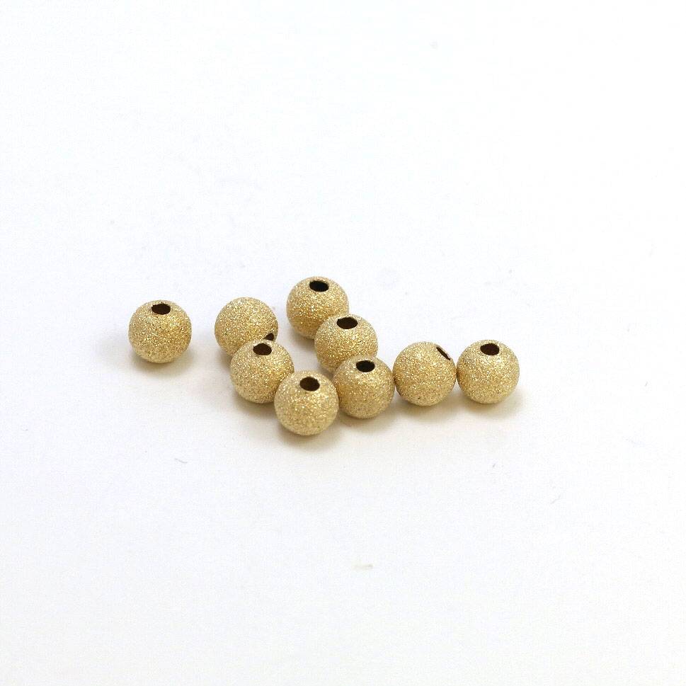 Goldfilled 14kt kralen - rond 6 mm 'stardust'