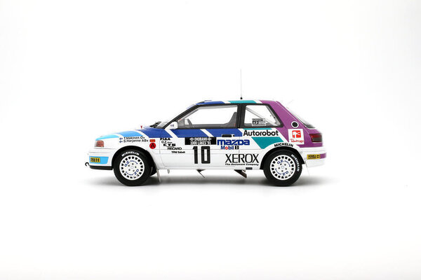 Mazda Mazda 323 GTX Gr.A #10 1000 Lakes Rally T.Makinen 1991 - 1:18 - Otto Mobile Models Mazda Mazda 323 GTX Gr.A #10 1000 Lakes Rally T.Makinen 1991 - 1:18 - Otto Mobile Models