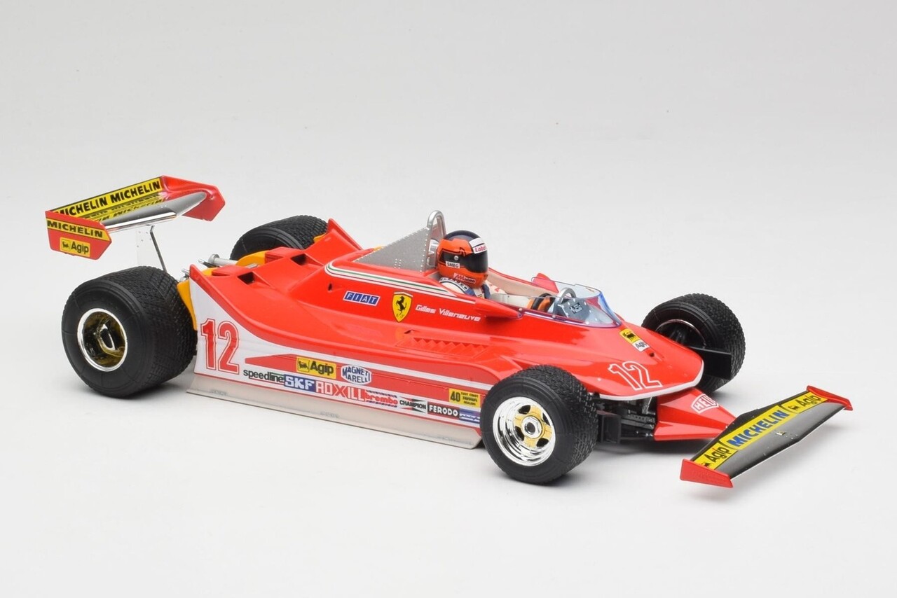 Formule 1 Ferrari F1 312T4 #12 Winner GP Watkins Glen USA (G.Villeneuve)) + Pilot Figure + Rain Wheels  -1:18 - Bburago