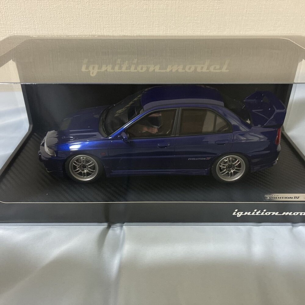 Mitsubishi Mitsubishi Lancer Evolution IV (CN9A) - 1:18 - Ignition Model Mitsubishi Mitsubishi Lancer Evolution IV (CN9A) - 1:18 - Ignition Model
