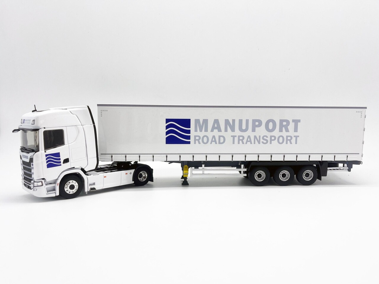 Scania Scania S500 V8 Truck 4x2 +Semi Curtainside Trailer 3 Axle 'Manuport Transports' 2018 - 1:43 - Eligor