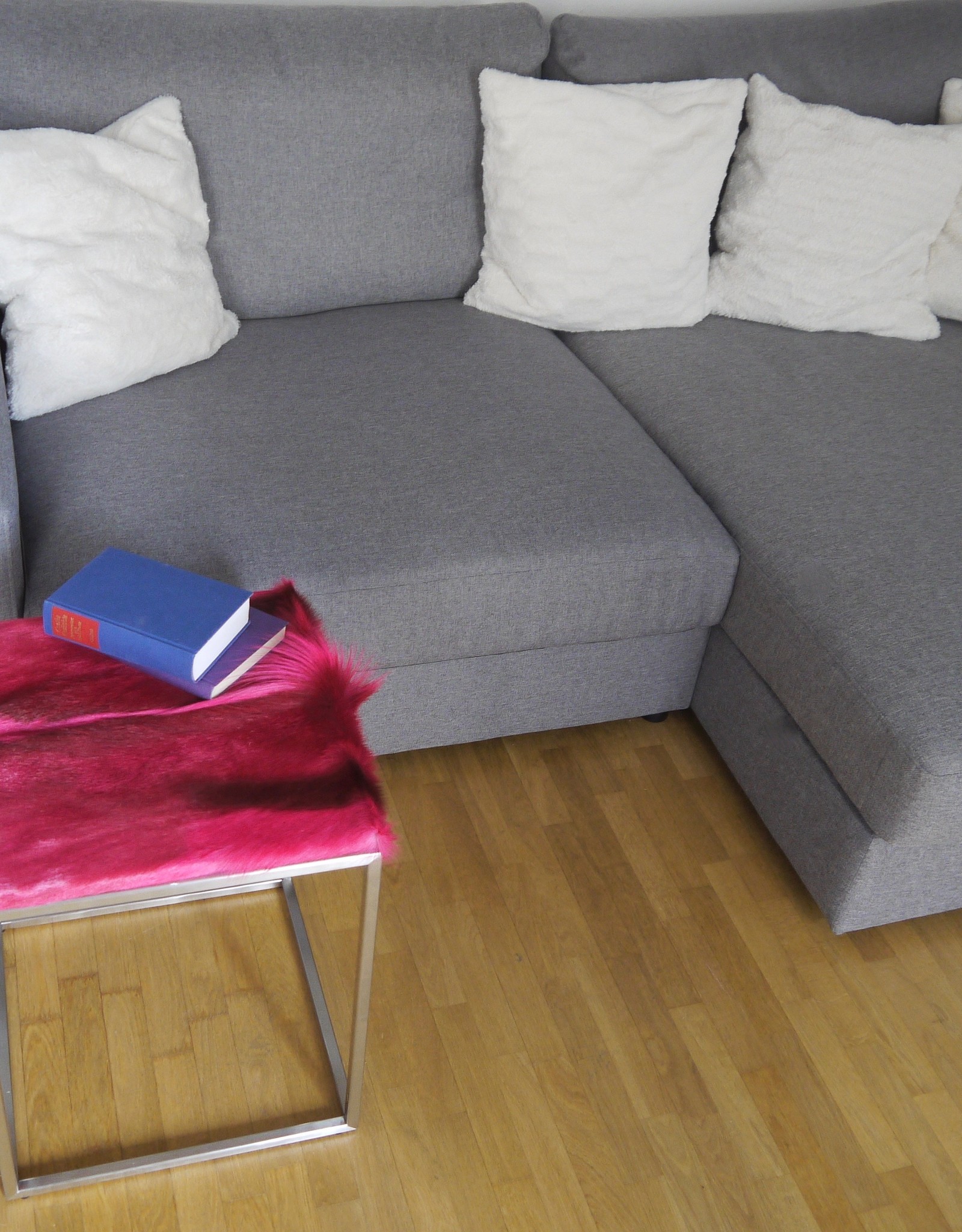 Side table made of pink coloured real springbok fur