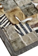 Fur rug made from genuine African wild animal skins - with leather edging