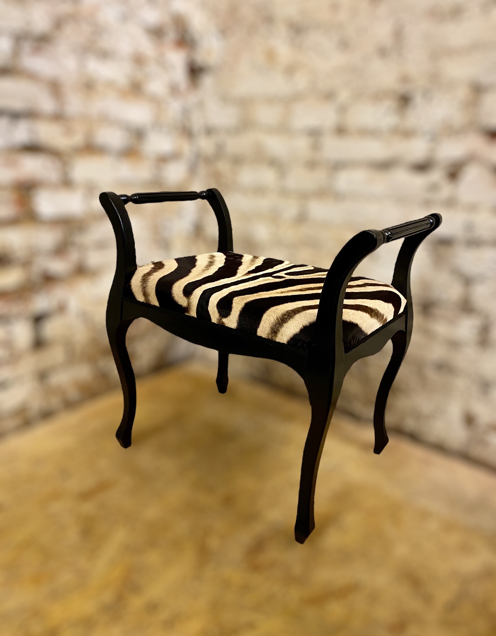 Zebra stool Elegant in Chippendale style made of real zebra hide with armrest