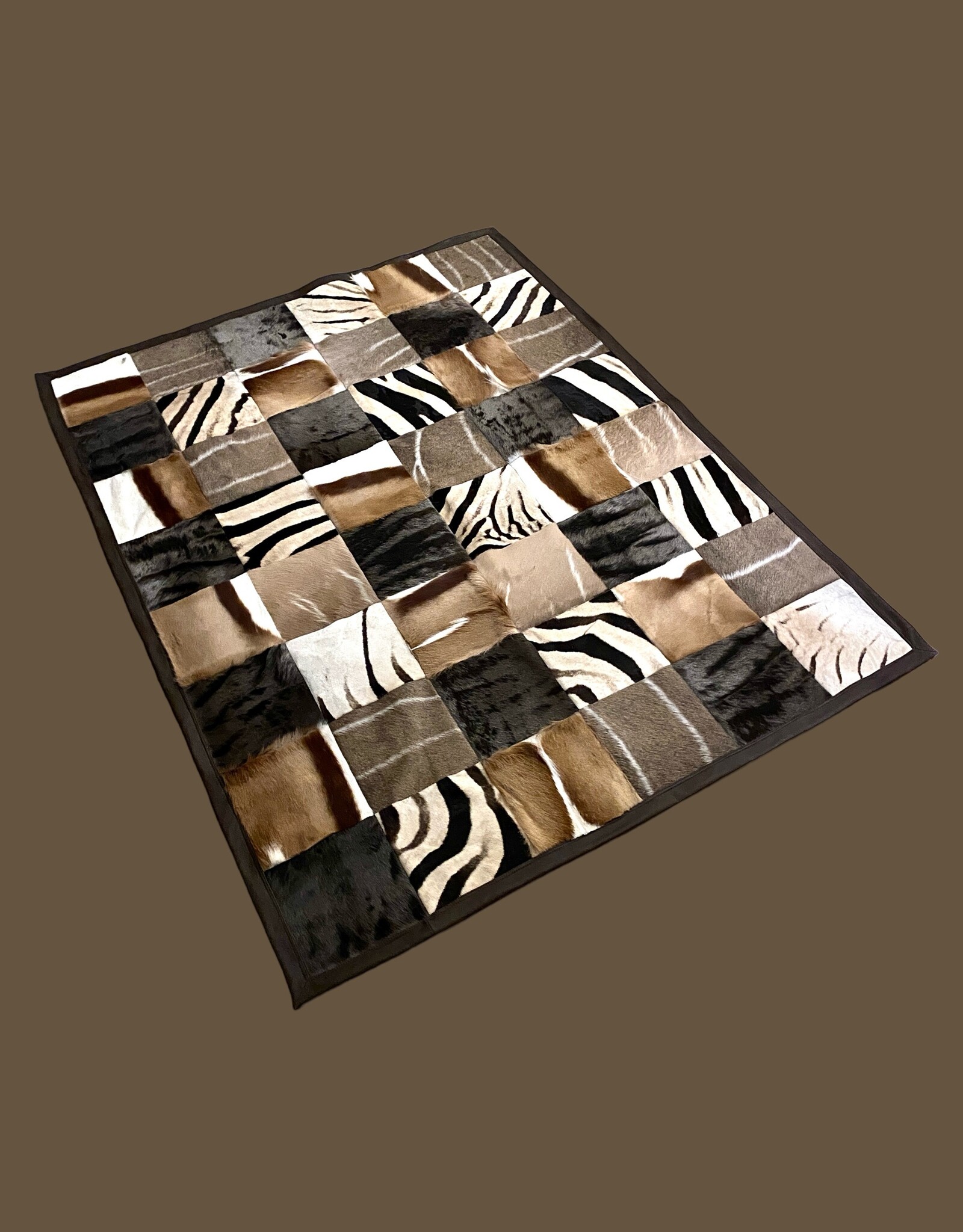 Fur rug made from genuine African wild animal skins - with leather edging