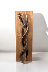 Sculpture made of natural colored kudu horns partially sanded on flamed wood Natural. Harmonious. Timeless.