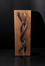 Sculpture made of natural colored kudu horns partially sanded on flamed wood Natural. Harmonious. Timeless.