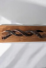 Sculpture made of natural colored kudu horns partially sanded on flamed wood Natural. Harmonious. Timeless.