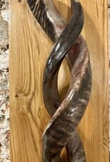 Sculpture made of natural colored kudu horns partially sanded on flamed wood Natural. Harmonious. Timeless.