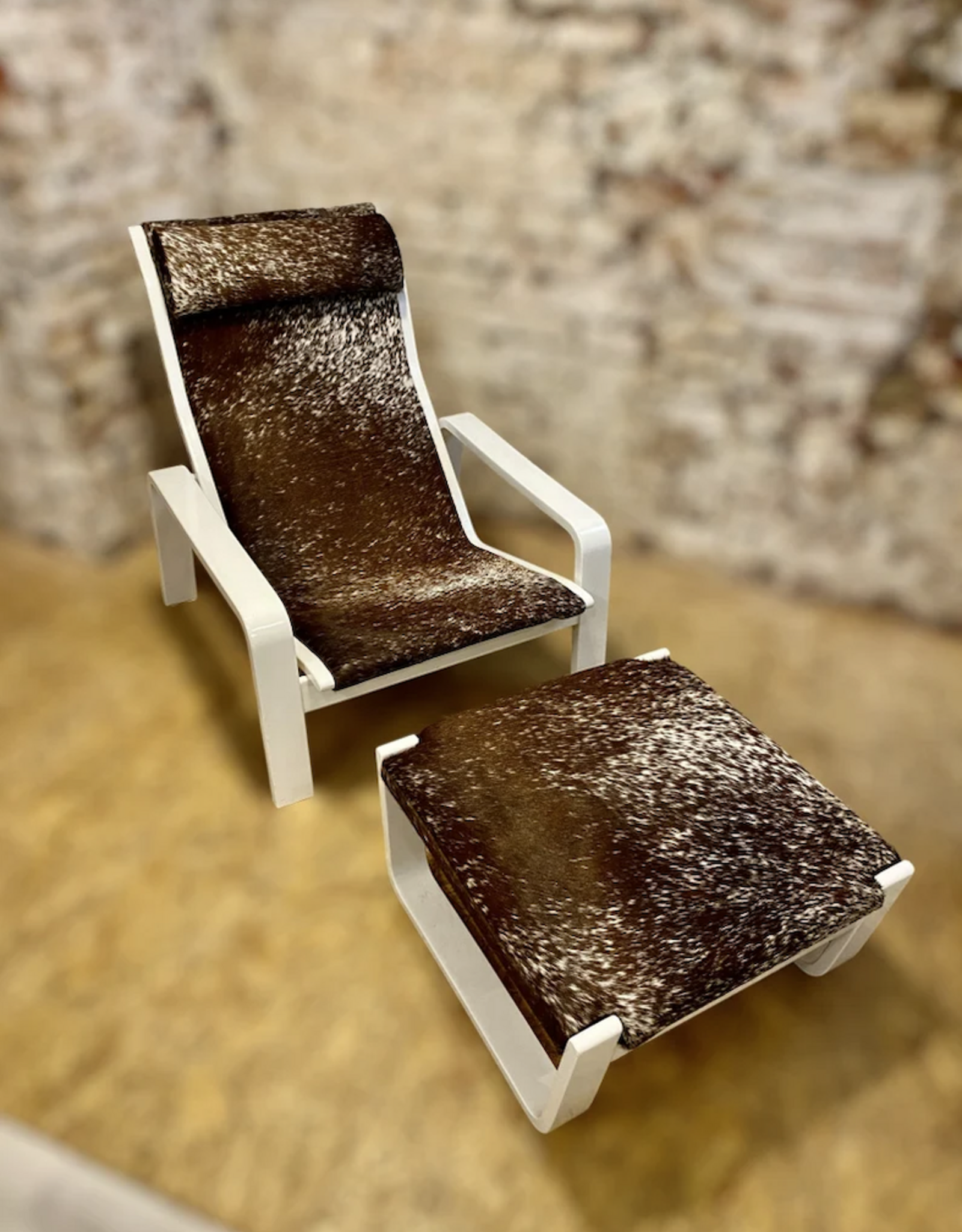 Designer armchair with stool covered with genuine Nguni furFinnish mid-centre Pulkka armchair with footstool by Ilmari Lappalainen for Asko, 1960s, set of 2