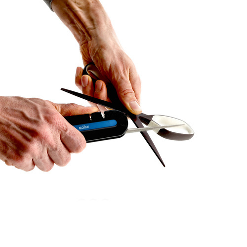Country mobile knife sharpener with compass and emergency whistle