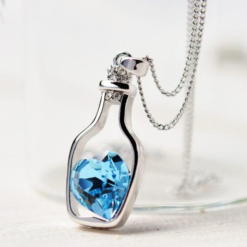 Janshop NIEUW ketting zilverkleur fles met blauw strass hart