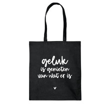 Zwarte katoenen tas met tekst 'Geluk is genieten van wat er is'