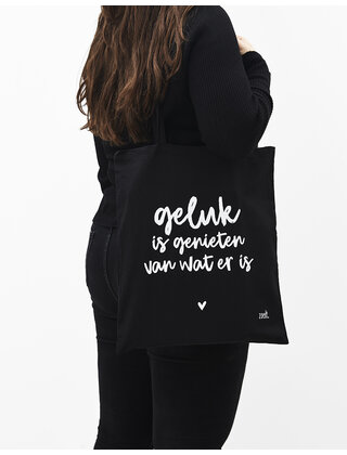Zwarte katoenen tas met tekst 'Geluk is genieten van wat er is'