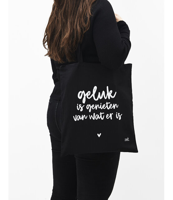 Zwarte katoenen tas met tekst 'Geluk is genieten van wat er is' Zwarte katoenen tas met tekst 'Geluk is genieten van wat er is'