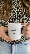 Witte mok met tekst 'Geniet'