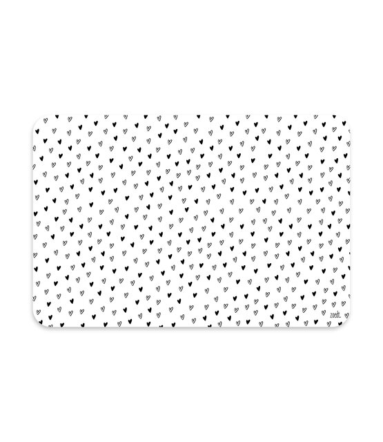 Placemat van wit vinyl met zwart hartjes patroon – een stijlvolle en praktische toevoeging aan jouw eettafel