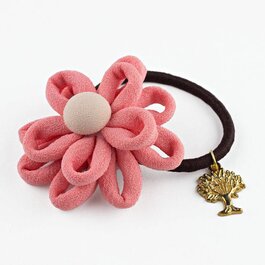 Haar elastiekje bloem met bedeltje