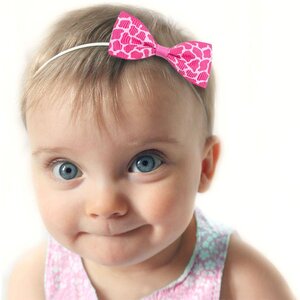 Baby haarbandje met mini strikje (luipaard roze)