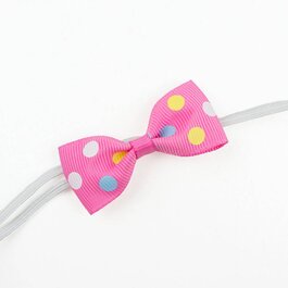 Haarbandje met mini strikje (roze stippel)