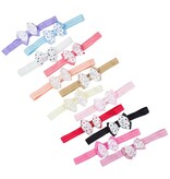 Baby haarbandje met dubbel hartjes strikje (koraal)