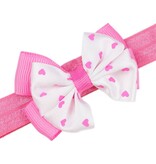 Baby haarbandje met dubbel hartjes strikje (roze)