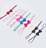 Baby haarbandje met mini strikje (roze)