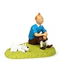 moulinsart Tintin statue - Tintin sitting on the grass