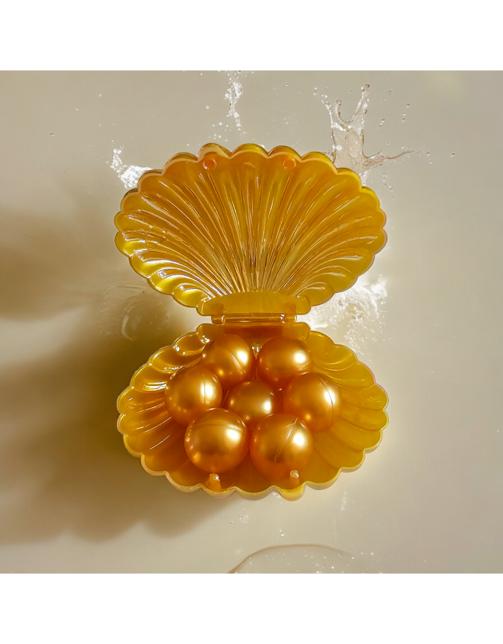 Schelp (goud) gevuld met 7 badparels- Body & Soap