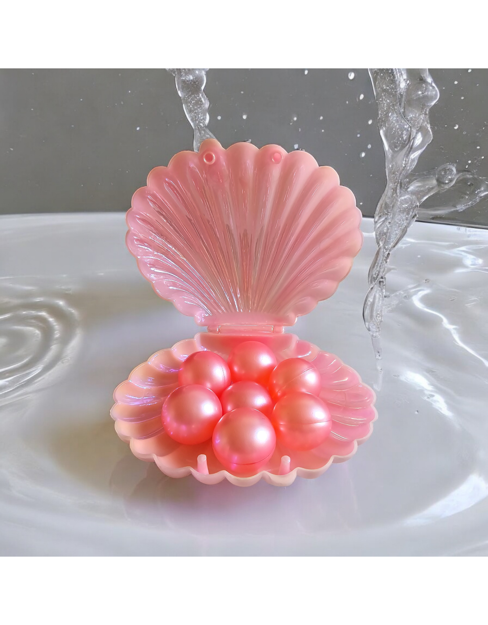 Schelp (roze) gevuld met 7 badparels- De perfecte badaccessoire