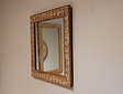 Spiegel met houtsnijwerk lijst 61x58cm