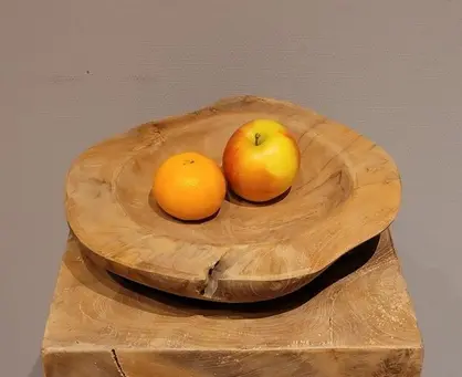 Houten fruitschaal kiezen: strak teak of organisch wortelhout?