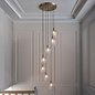 Una - Staircase Light - 7 Light Cascading Pendant - Antique Brass