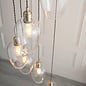 Una - Staircase Light - 7 Light Cascading Pendant - Antique Brass