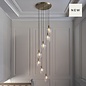 Una - Staircase Light - 7 Light Cascading Pendant - Antique Brass