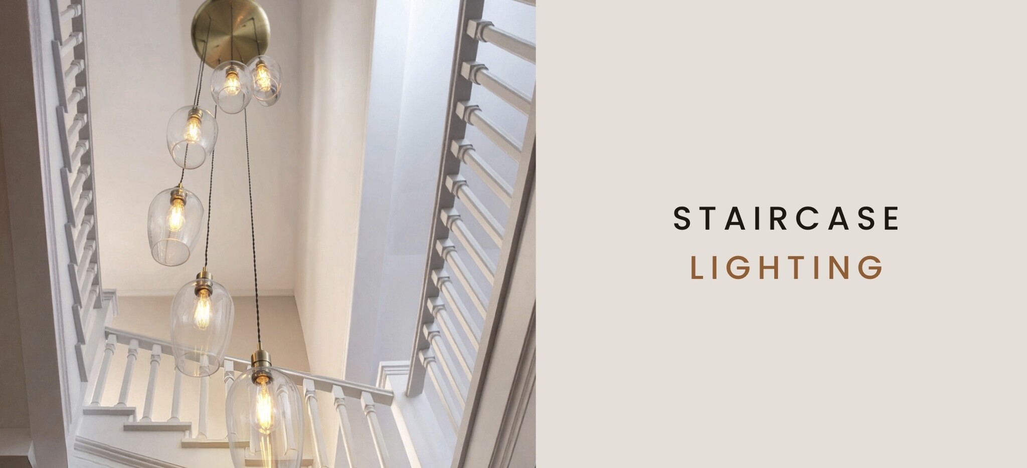 staircase pendant lights in a stairwell with multi drop cluster design