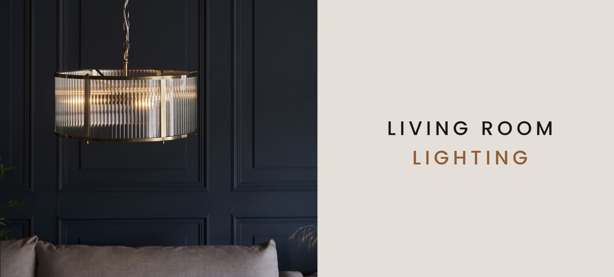 Modern living room lighting featuring a ribbed glass brass pendant ceiling light above a neutral sofa