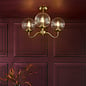 Jocelyn 3 Light Mid Century Semi-Flush Ceiling Light – Natural Brass and Glass Globes